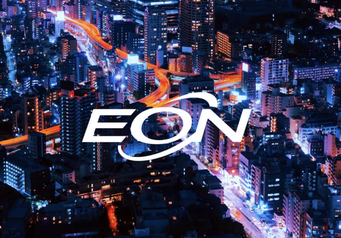 The EON wordmark over a night-time city lit by traffic light trails